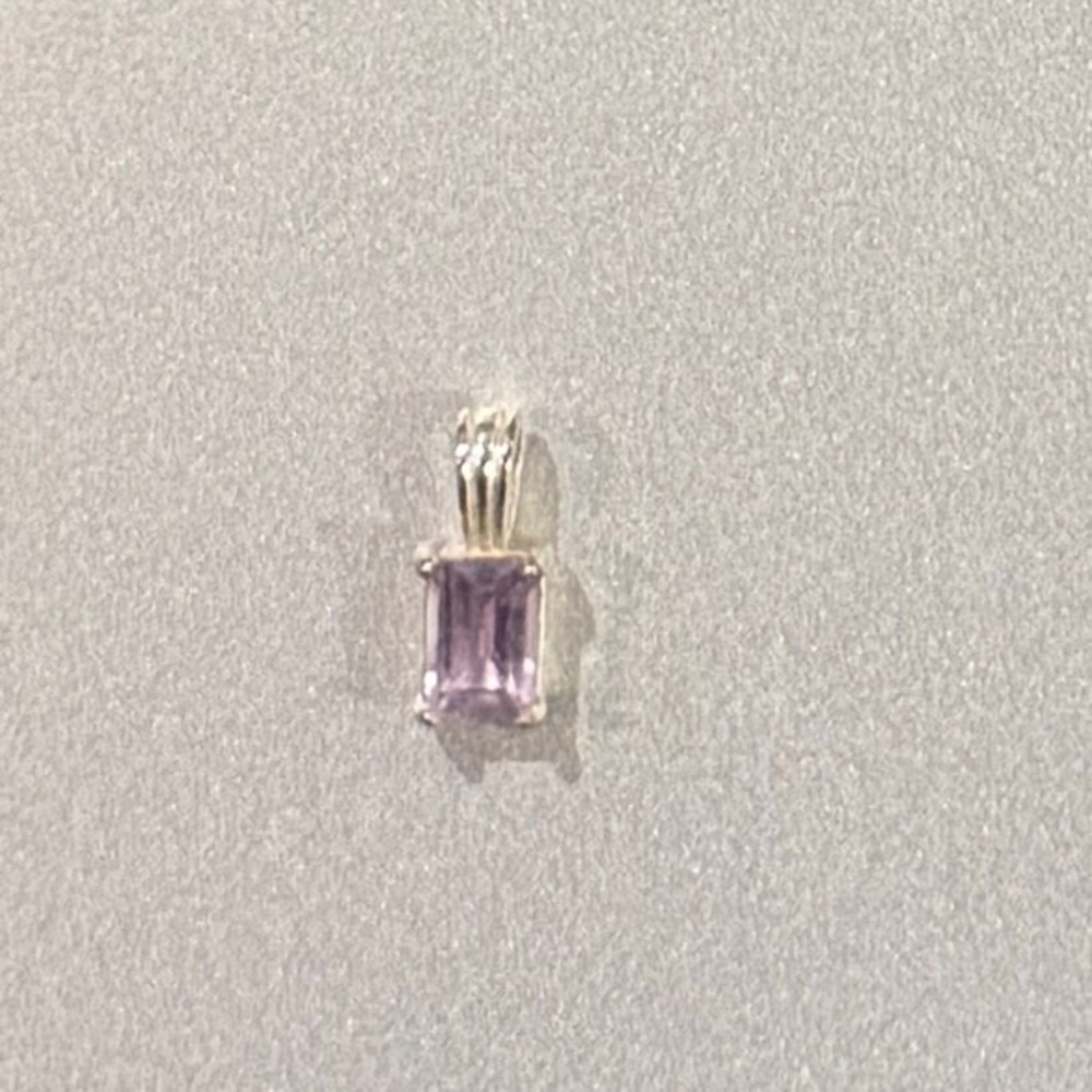 Pale pink sapphire neck charm.